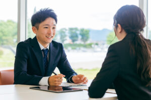 Man in interview with female 